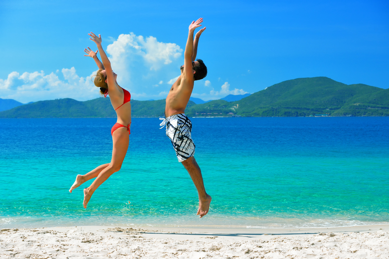 a-young-couple-on-a-beach-vacation-on-the-background-of-the-islands-6129216790