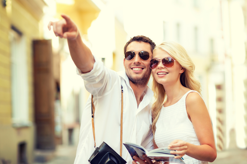 couple-with-map-camera-and-travellers-guide-6138078290