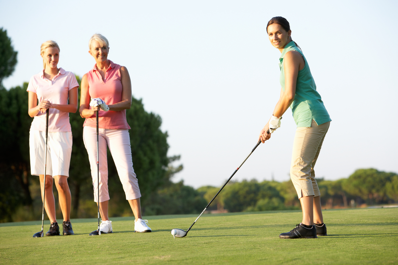 group-of-female-golfers-teeing-off-06085158735