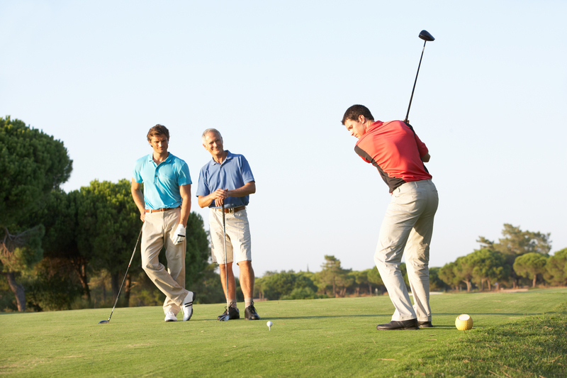 group-of-male-golfers-teeing-off-16085155645
