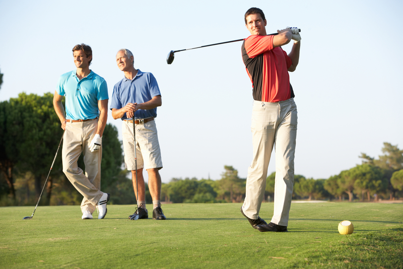 group-of-male-golfers-teeing-off-3608510665