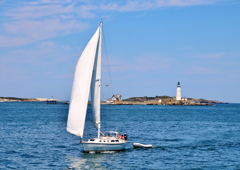 yacht-sailing-in-front-of-boston-harbor-lighthouse-864432445915